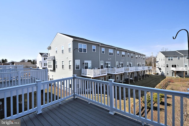 wooden terrace featuring a residential view