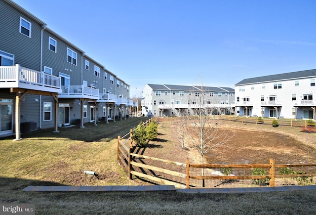 view of yard with fence and a residential view