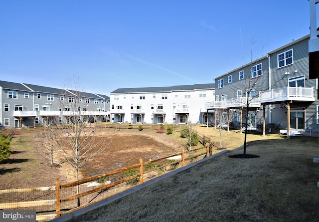 exterior space with a residential view and fence