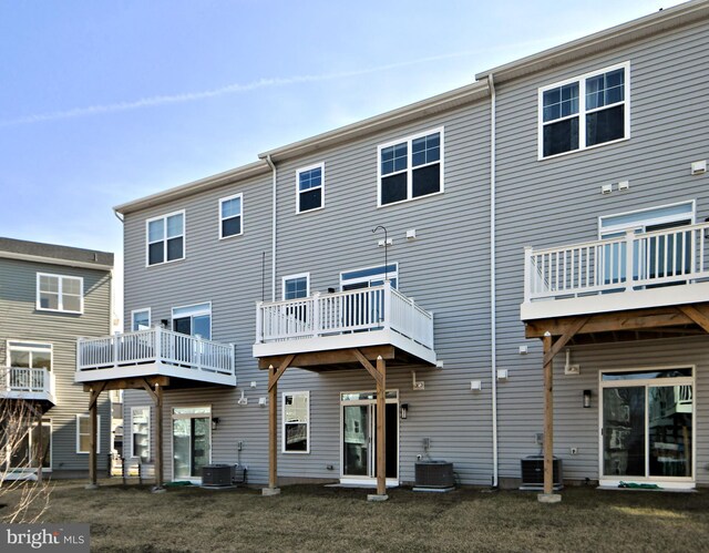 back of house featuring central AC