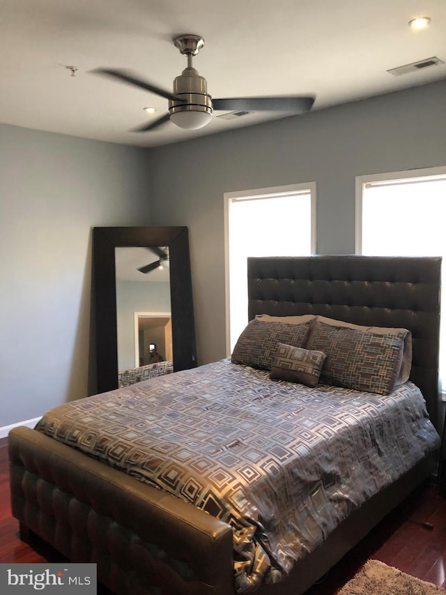 bedroom featuring ceiling fan, wood finished floors, visible vents, and recessed lighting