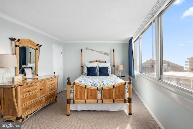 bedroom with carpet floors, ornamental molding, and baseboards