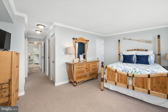 carpeted bedroom with ornamental molding and baseboards