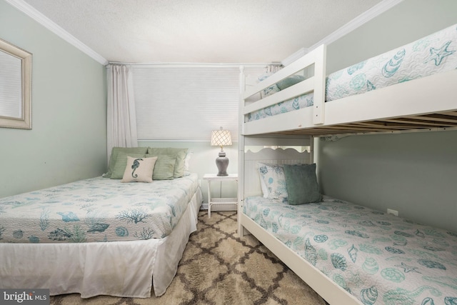 bedroom featuring ornamental molding and a textured ceiling