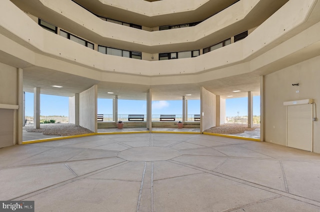 unfurnished room with a towering ceiling