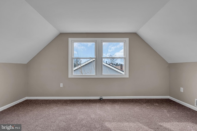 bonus room featuring carpet, vaulted ceiling, and baseboards