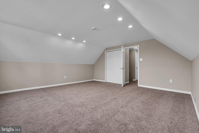 additional living space with lofted ceiling, carpet, baseboards, and recessed lighting