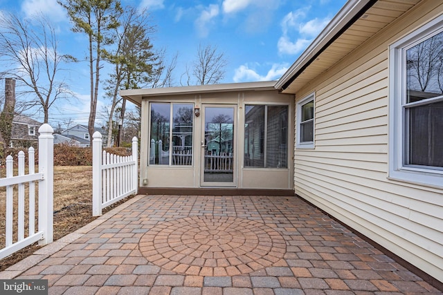 view of patio featuring fence