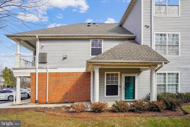 view of front of property featuring roof with shingles