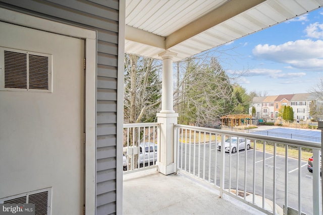 balcony featuring visible vents and a residential view