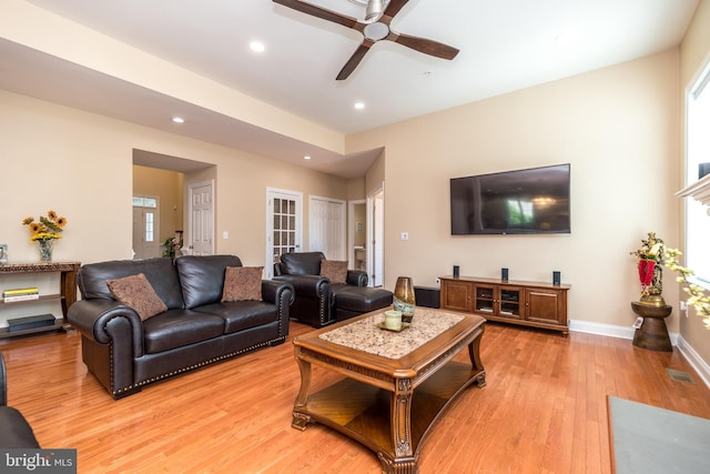 living area featuring recessed lighting, baseboards, light wood-style floors, and ceiling fan