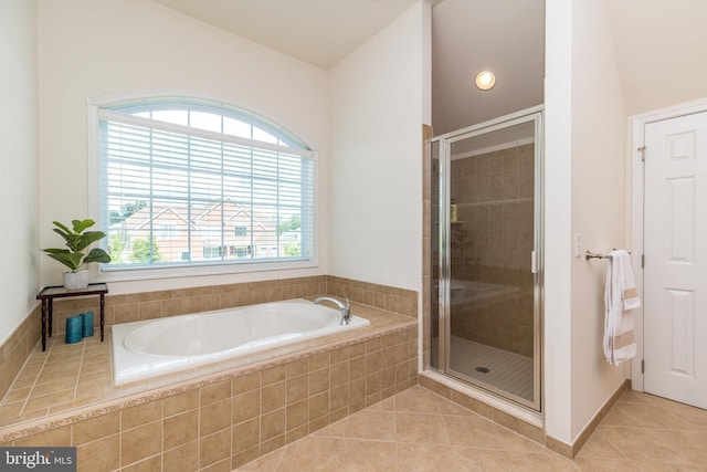 full bathroom with tile patterned floors, a stall shower, and a bath