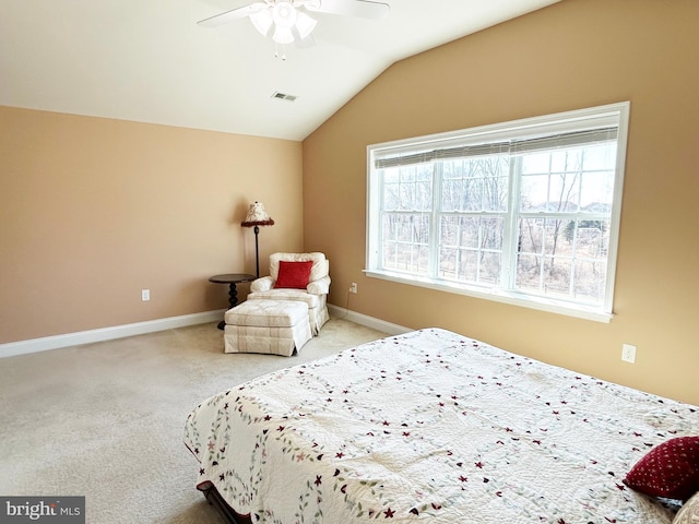 bedroom with carpet floors, visible vents, baseboards, and vaulted ceiling