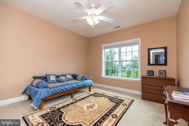 carpeted bedroom featuring visible vents, ceiling fan, and baseboards