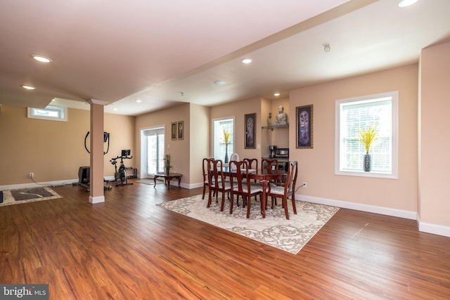 dining space featuring recessed lighting, baseboards, and wood finished floors