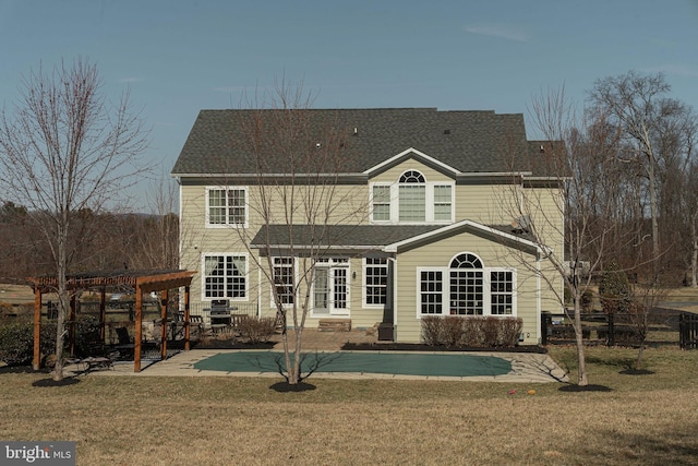 back of property featuring a patio, fence, roof with shingles, a yard, and a pergola