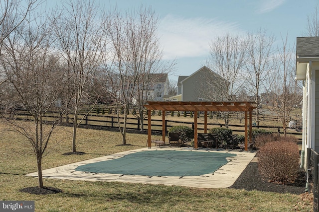 view of pool with a covered pool, fence, a lawn, a pergola, and a patio