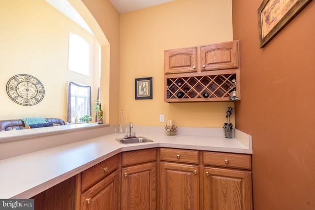 bar featuring wet bar and a sink