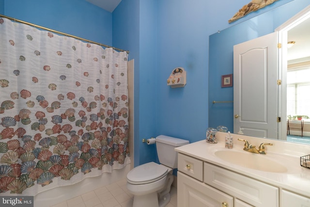 full bathroom with tile patterned floors, toilet, shower / tub combo with curtain, and vanity