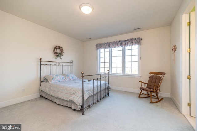 bedroom featuring light carpet, visible vents, and baseboards