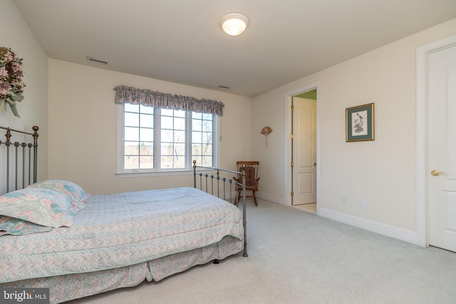 bedroom with visible vents, carpet floors, and baseboards