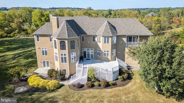 exterior space featuring a wooded view