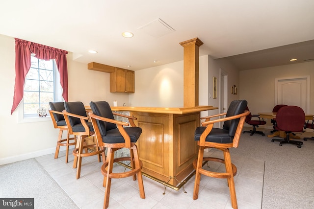 bar featuring recessed lighting, baseboards, light colored carpet, and indoor bar