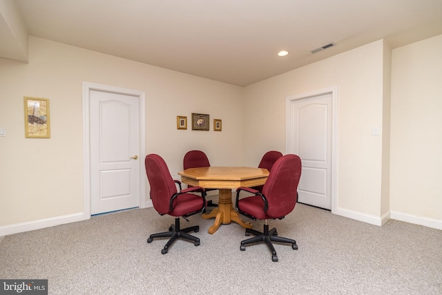 office space featuring carpet flooring, baseboards, and visible vents