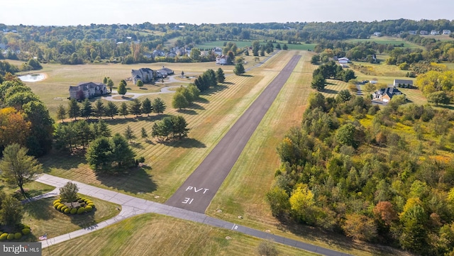 birds eye view of property featuring a rural view