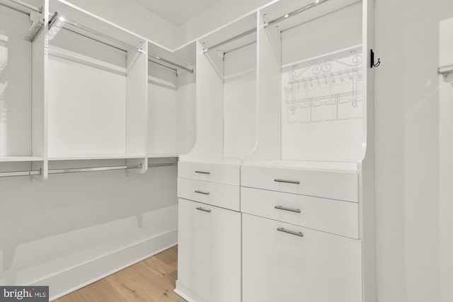 spacious closet with light wood-style floors