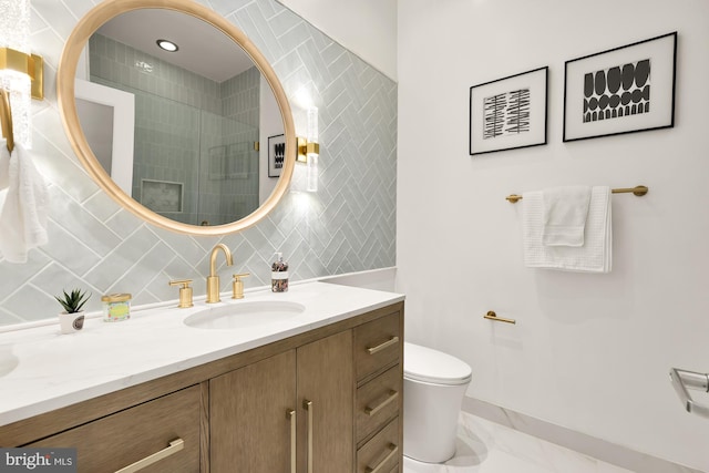 full bath with marble finish floor, tile walls, toilet, vanity, and tiled shower