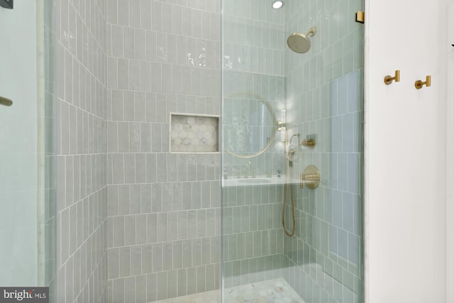 full bathroom with tiled shower