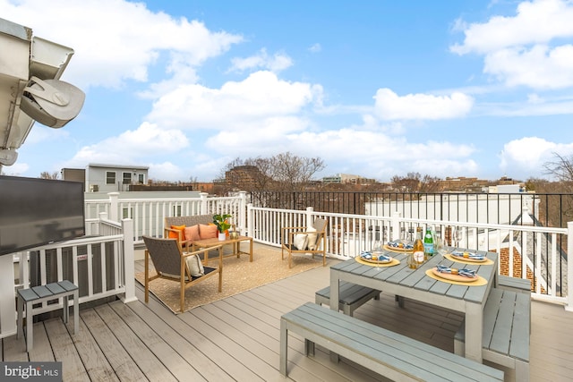 wooden terrace featuring outdoor lounge area