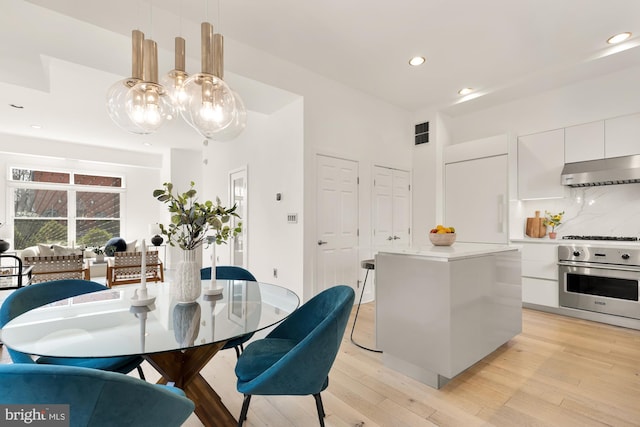 dining room featuring recessed lighting, visible vents, and light wood finished floors