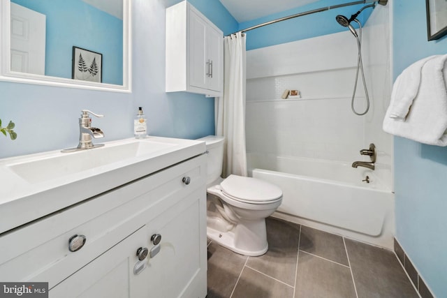 bathroom featuring shower / tub combo, vanity, toilet, and tile patterned floors