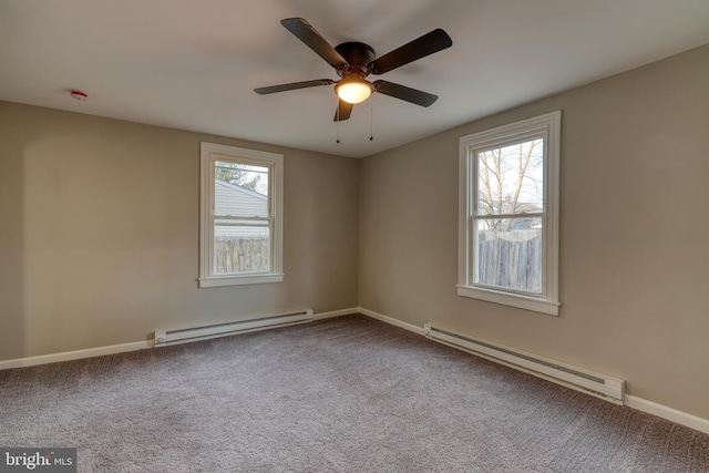 unfurnished room with a baseboard radiator, baseboards, ceiling fan, and carpet flooring