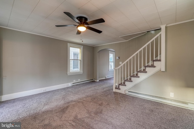 interior space with ornamental molding, baseboard heating, and stairs