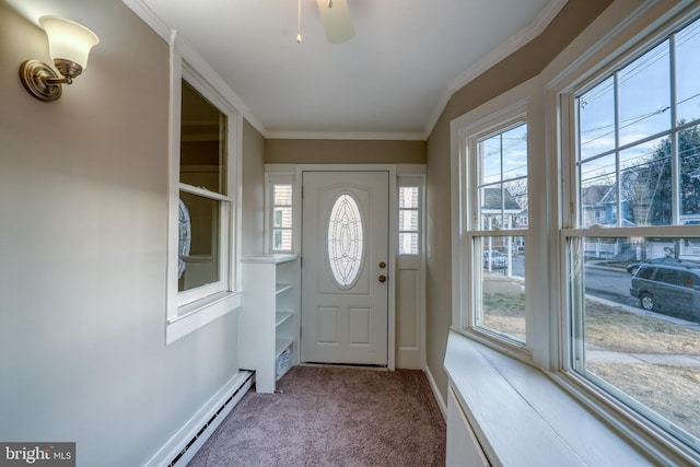 interior space with plenty of natural light, crown molding, baseboards, and carpet flooring