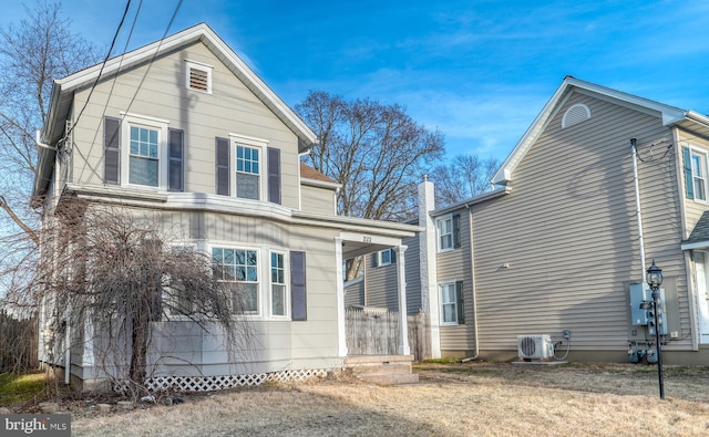 view of side of property featuring ac unit