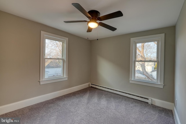 empty room with ceiling fan, a baseboard radiator, carpet flooring, and baseboards