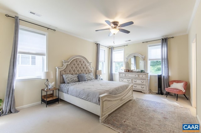 bedroom featuring ornamental molding, light colored carpet, visible vents, and baseboards