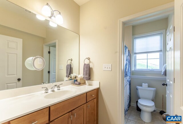 full bath featuring tile patterned flooring, baseboards, vanity, and toilet