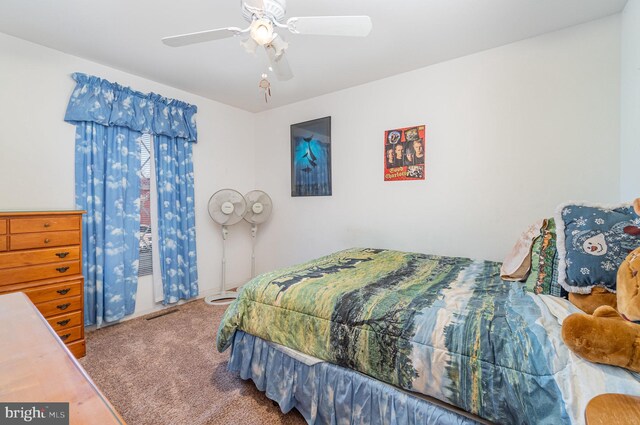 bedroom with ceiling fan and carpet