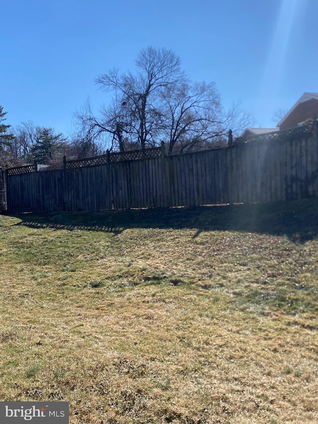 view of yard with fence