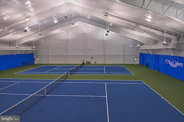 view of tennis court with community basketball court and fence