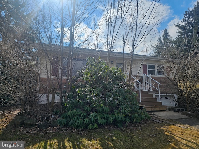 view of front of property featuring brick siding