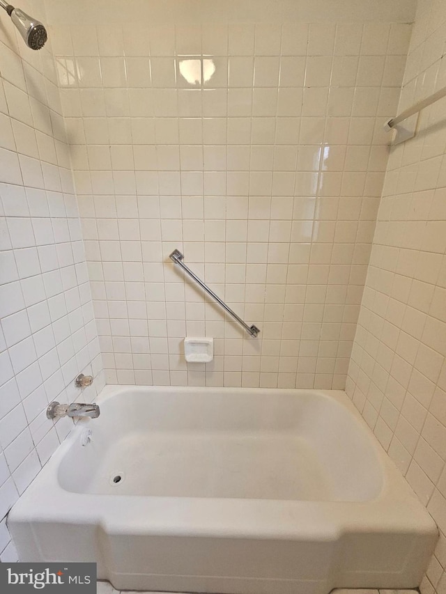 full bathroom featuring a shower and a bathing tub