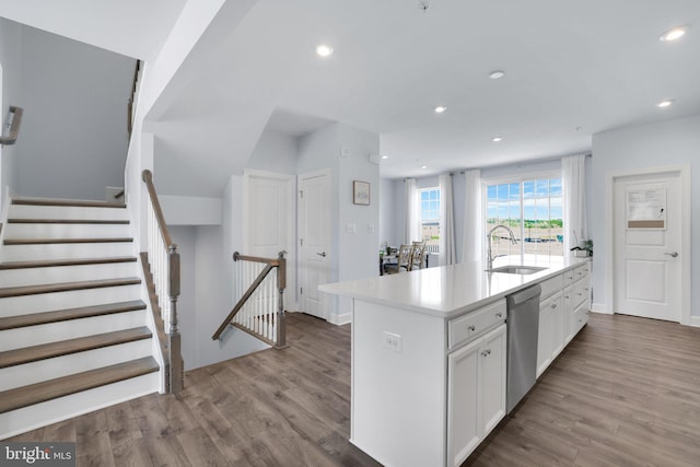3802 Rock Spring Dr, Upper Marlboro, MD 20772 - kitchen with a sink, white cabinetry, wood finished floors, and dishwasher