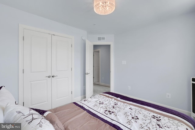 3802 Rock Spring Dr, Upper Marlboro, MD 20772 - bedroom with visible vents, baseboards, a closet, and light colored carpet