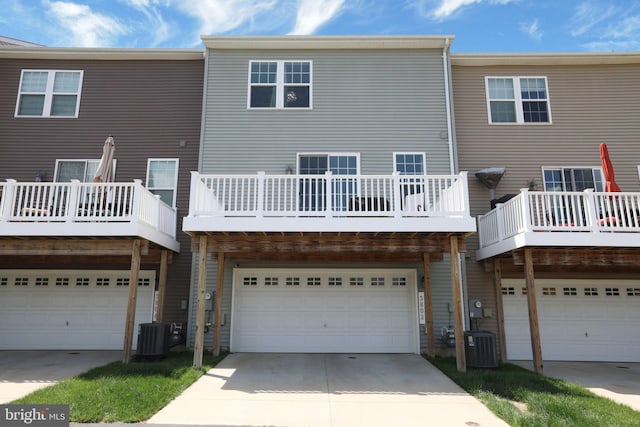 3802 Rock Spring Dr, Upper Marlboro, MD 20772 - rear view of property featuring an attached garage, central AC unit, and driveway